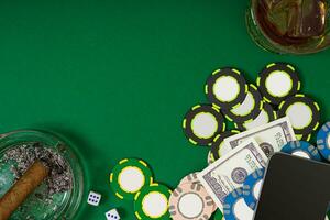 Set to playing poker with cards and chips on green background photo