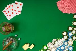 Set to playing poker with cards and chips on green background photo