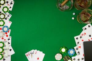 Set to playing poker with cards and chips on green table, top view photo