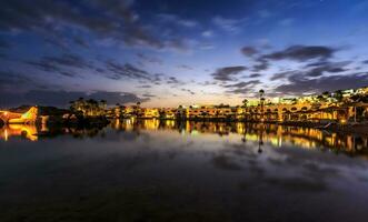 Evening view from sea for luxury hotel in night illumination photo