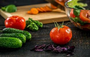 Male hands cutting vegetables for salad photo