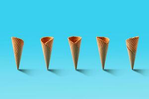 Ice cream cones pattern. Turquoise background. Sweet, summer and empty concept. photo