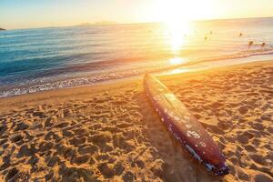 Beach coast with float in the Red Sea during sunrise. photo