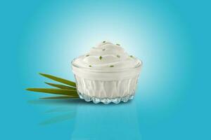 Creamy, white sauce in the bowl with green onion on a blue background with copy space. Advertising concept. Close-up shot. photo