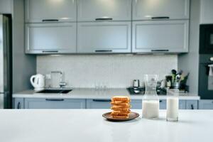 Toast wheat bread sliced and cow milk on table, breakfast in morning photo