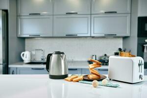 Fresh delicious breakfast with crispy toasts and cup coffee or tea on grey background. photo