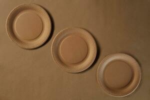 Eco friendly disposable tableware. Biodegradable craft dishes. Recycling concept. Also used in fast food, restaurants, takeaways, picnics. Close-up. photo