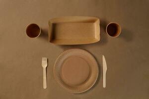 Eco friendly disposable tableware. Biodegradable craft dishes. Recycling concept. Also used in fast food, restaurants, takeaways, picnics. Close-up. photo