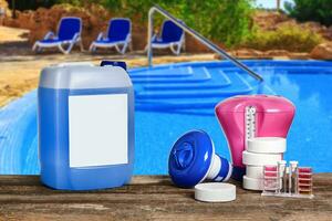 Equipment with chemical cleaning products and tools for the maintenance of the swimming pool. photo