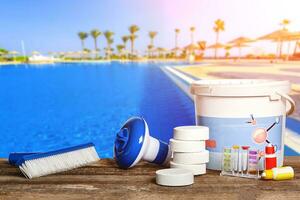 Equipment with chemical cleaning products and tools for the maintenance of the swimming pool. photo