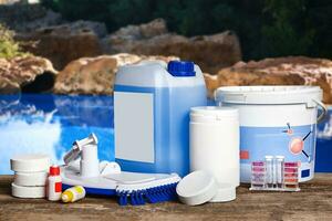 Equipment with chemical cleaning products and tools for the maintenance of the swimming pool. photo