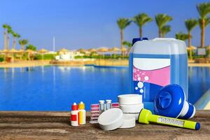 Equipment with chemical cleaning products and tools for the maintenance of the swimming pool. photo