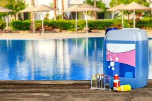 Equipment with chemical cleaning products and tools for the maintenance of the swimming pool. photo