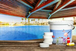 Equipment with chemical cleaning products and tools for the maintenance of the swimming pool. photo