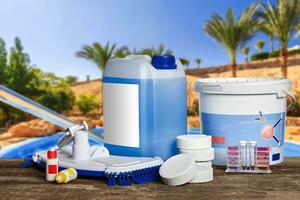 Equipment with chemical cleaning products and tools for the maintenance of the swimming pool. photo