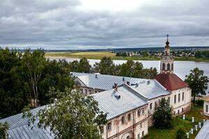 Eastern orthodox crosses on gold domes, cupolas, against blue sky with clouds photo