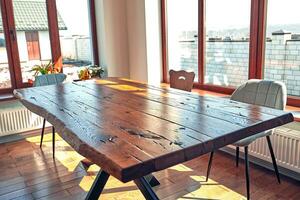 Interior of modern house, dining room with wooden table photo