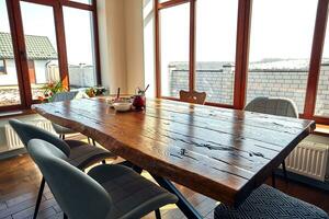 Interior of modern house, dining room with wooden table photo