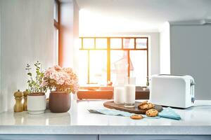 Cookies and Milk with an glass milk bottle on a kitchen counter for a after school snack of cookies and milk photo