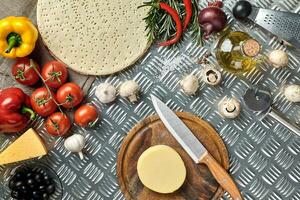 Ingredients for cooking pizza on metal table, top view photo