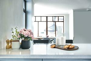 Cookies and Milk with an glass milk bottle on a kitchen counter for a after school snack of cookies and milk photo