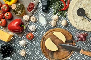 Ingredients for cooking pizza on metal table, top view photo