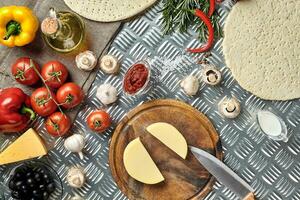 Ingredients for cooking pizza on metal table, top view photo