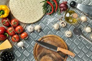 Ingredients for cooking pizza on metal table, top view photo