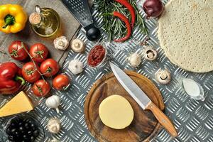 Ingredients for cooking pizza on metal table, top view photo