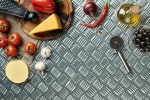 Ingredients for cooking pizza on metal table, top view photo