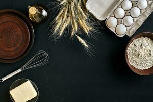 Dough preparation recipe bread, pizza or pie making ingredients, food flat lay on kitchen table background. Working with butter, yeast, flour, eggs, oil. Pastry or bakery cooking. photo