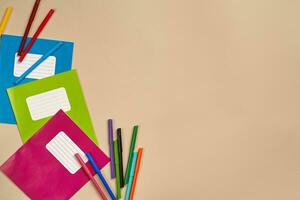 Flat lay photo of workspace desk with school accessories or office supplies.