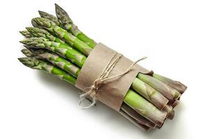 An edible, raw stems of asparagus isolated on white background. photo