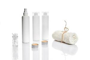 Set of cosmetic products in white containers on light background. photo