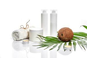 Organic cosmetics with coconut on white background. photo