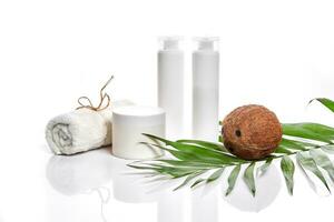 Organic cosmetics with coconut on white background. photo