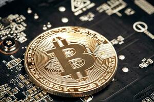 Bitcoin. New virtual money. Bitcoins lie on the video card, concept of mining. photo