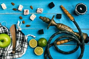 Tobacco background. Turkish smoking hookah with tobacco flavor of ripe green apple and lime photo