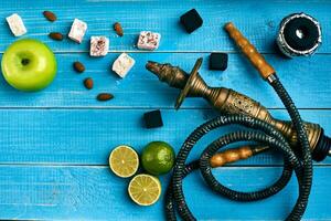 Tobacco background. Turkish smoking hookah with tobacco flavor of ripe green apple and lime photo