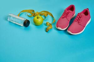 Sneakers, centimeter, green apple, weight loss, running, healthy eating, healthy lifestyle concept photo