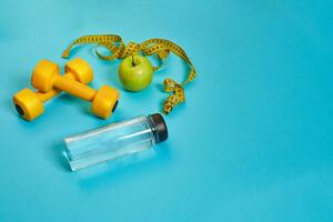 Dumbbells, centimeter, green apple, weight loss, healthy eating, healthy lifestyle concept photo