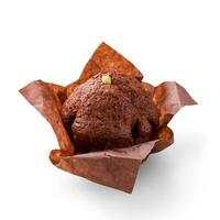 Delicious chocolate muffin on white background. Fresh chocolate cakes in decorative paper. photo