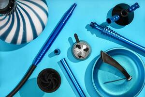 Top view of Hookah parts on light blue background photo