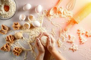 Female hands knead dough with egg and a rolling pin for preparation of cookies. Top view. Sun flare photo