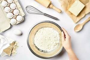 Hand sift flour. Bakery prepare for make cake. Top view photo