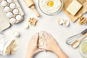 Baker preparing to knead the dough, top view. Cooking, bakery concept photo