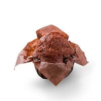 Delicious chocolate muffin on white background. Fresh chocolate cakes in decorative paper. photo