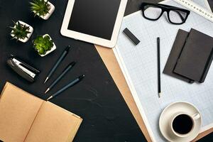 Architect's work tools on black background. Top view photo