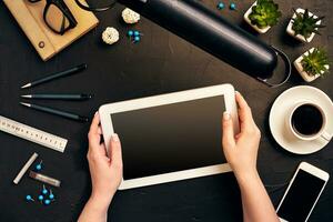 Architect working on blueprint. Architects workplace - architectural project, blueprints, tablet pc. Engineering tools. Top view photo