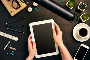 Architect working on blueprint. Architects workplace - architectural project, blueprints, tablet pc. Engineering tools. Top view photo